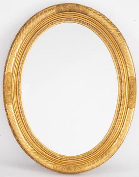 An oval mirror from around the year 1900.