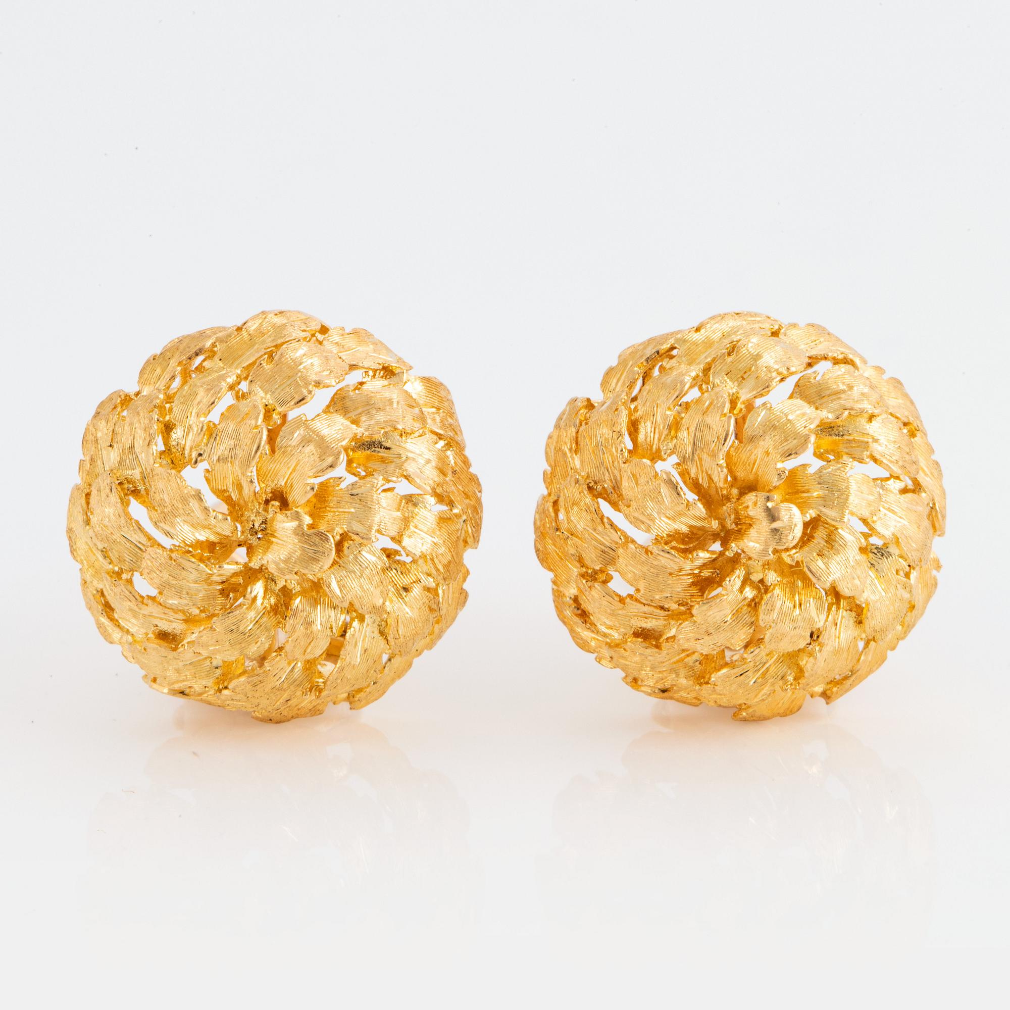 A pair of 18K gold earrings.