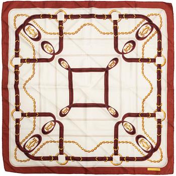 Three Cartier silk scarves.