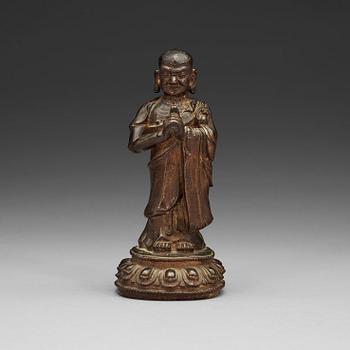 1310. A bronze figure of a Lohan, Ming dynasty, 17th Century.