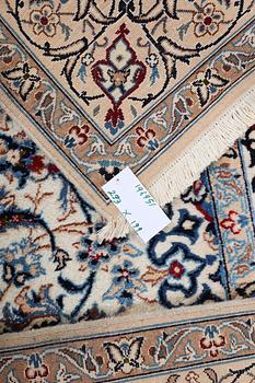 A Nain carpet, part silk, c. 293 x 199 cm.