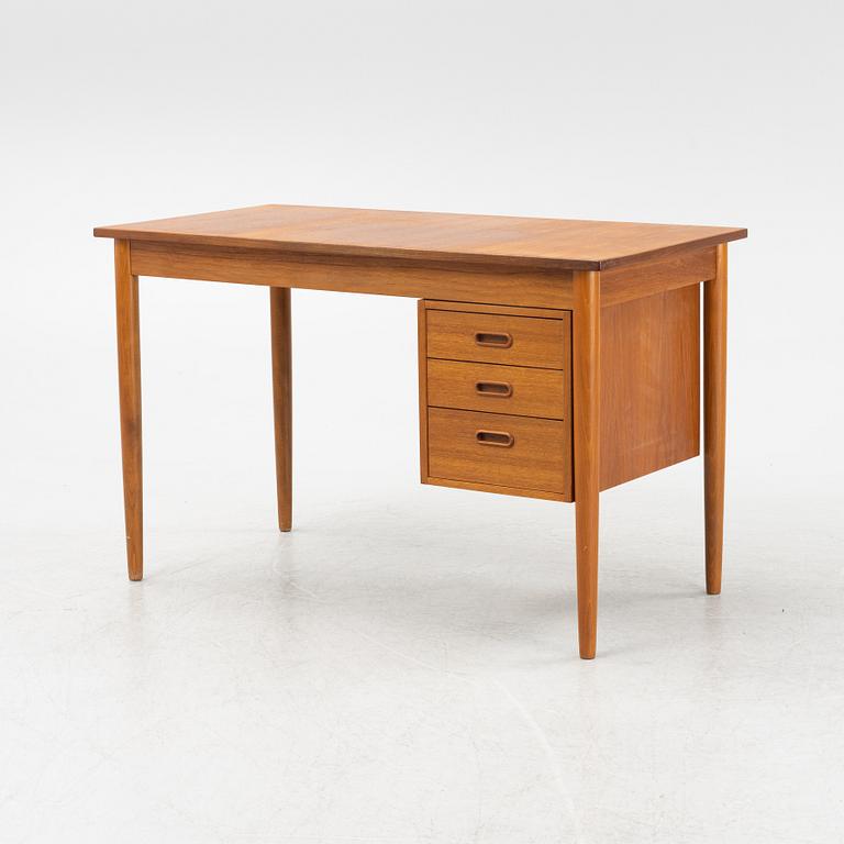 A teak veneered desk, 1950's/60's.