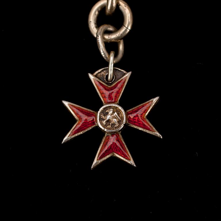 KLOCKKED, silver, heraldiskt kors i emalj "Order of the Griffin" hederskors. 1800-talets slut. Vikt 54,8 g.