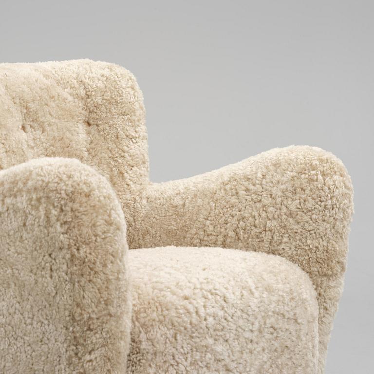 Fritz Hansen, a pair of easy chairs model "1669", Denmark, 1940s.