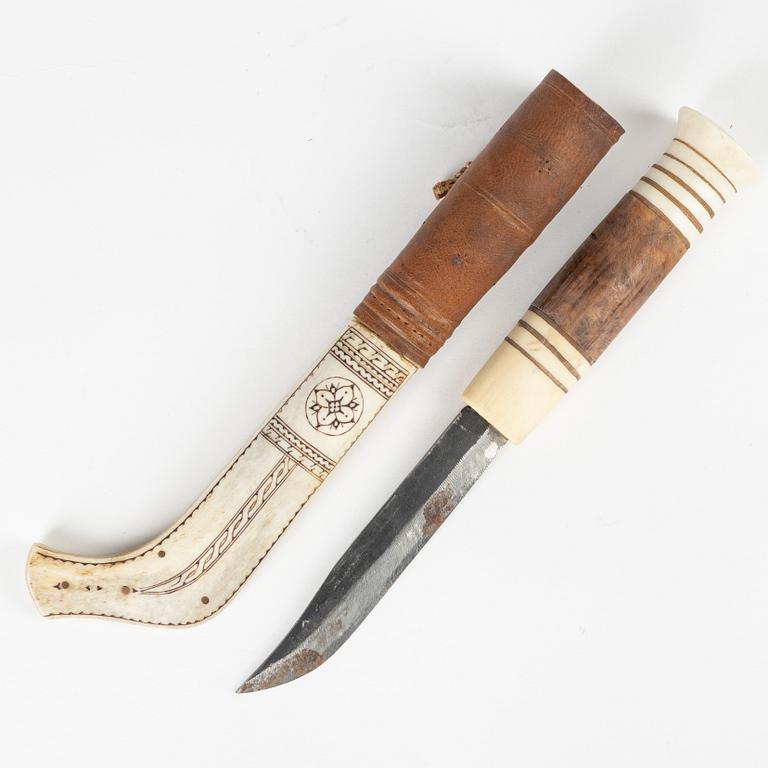 A reindeer horn knife signed LB.