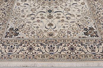 A Nain carpet, part silk, so-called 9 LAA, approx. 355 x 248 cm.