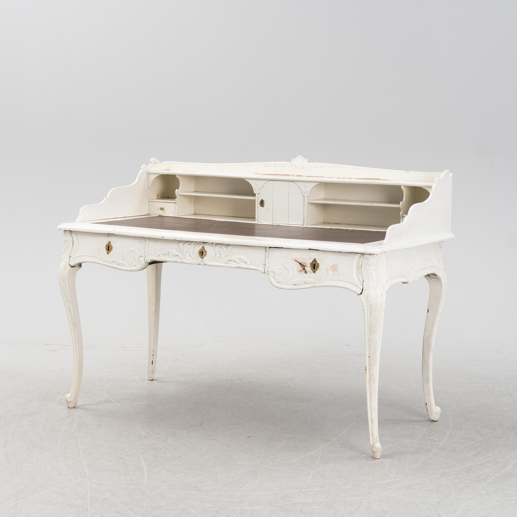 A painted rococo writing desk, mid 18th Century with later parts.