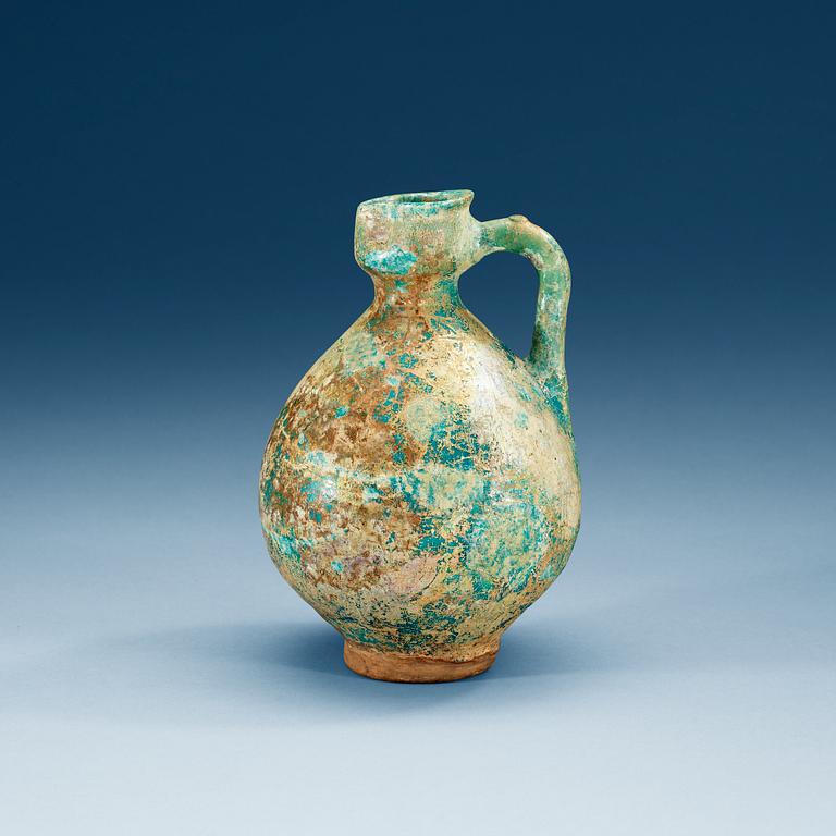 EWER, pottery. Turquoise glaze. Persia 13th century, probably Kashan.