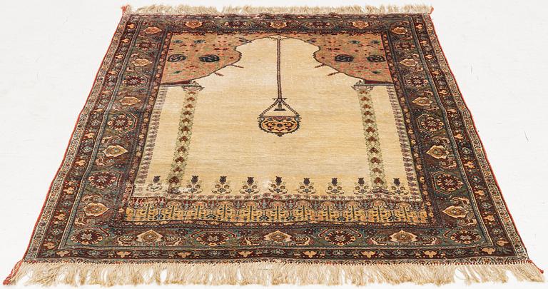 A semi-antique silk rug, probably Tabriz, c 164 x 110 cm,.