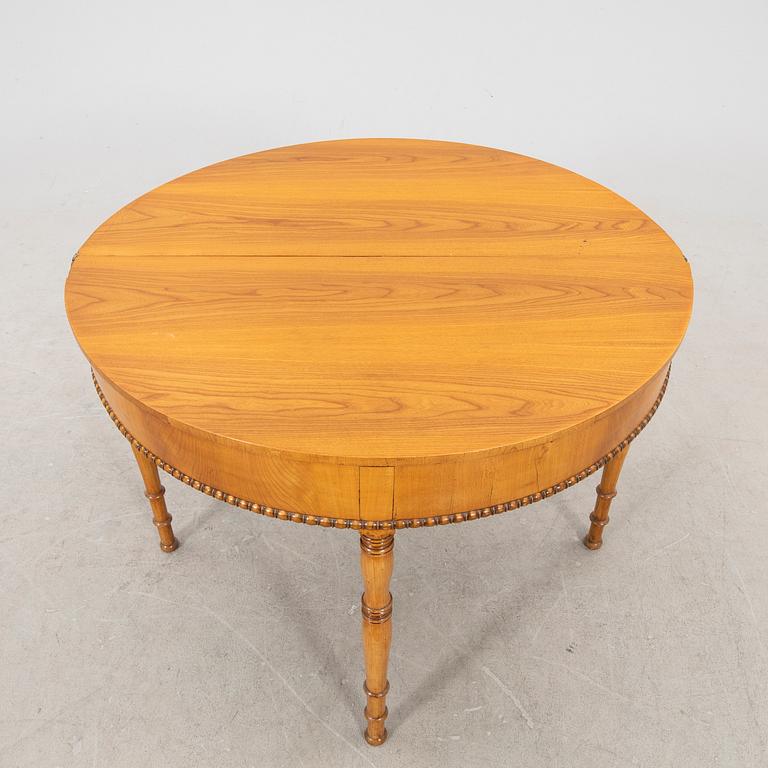 A kid 1800s late Empire birch game table.