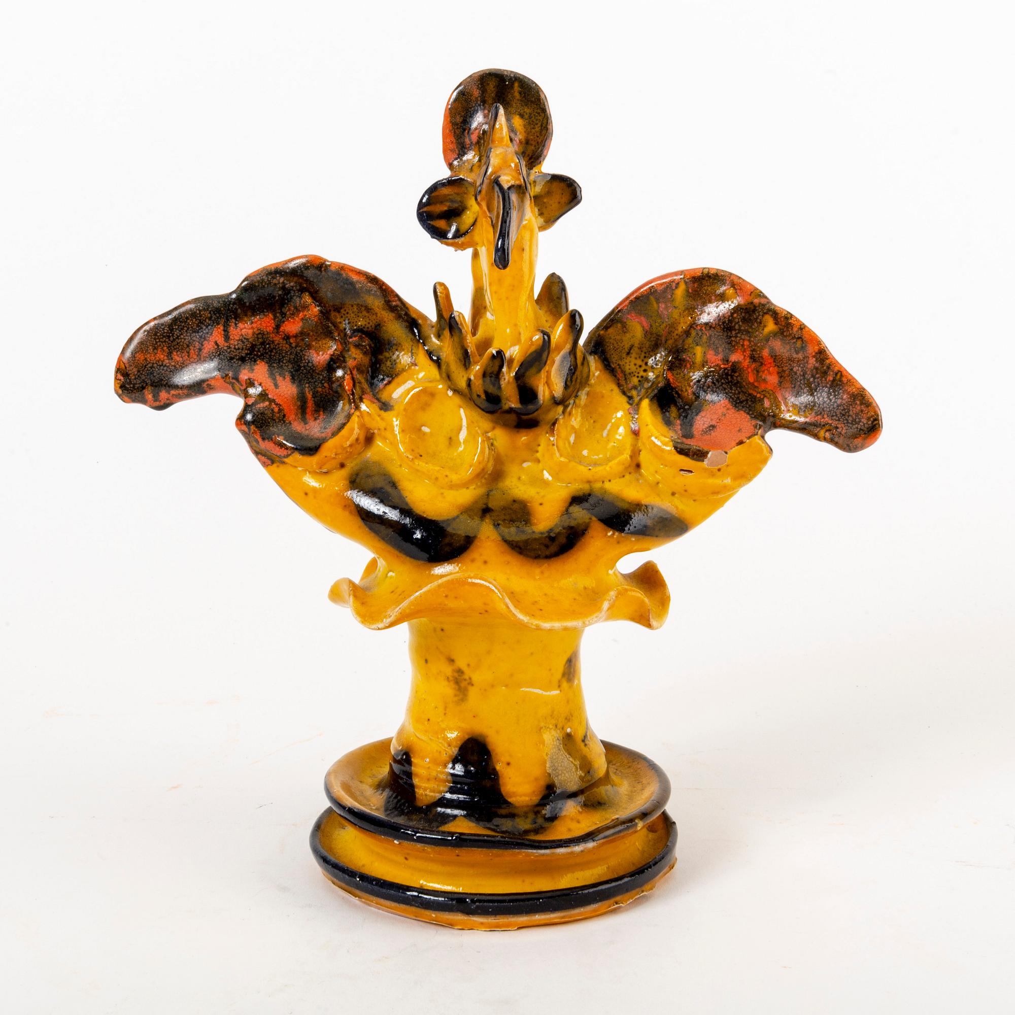 A signed Ulrica Hydman-Vallien stoneware figurine.