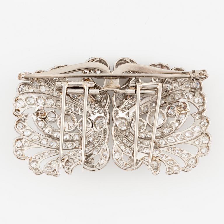A brooch/double clip in platinum set with old- and eight cut diamonds.