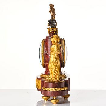 A French Empire 19th century gilt bronze mantel clock signed Lamiral.