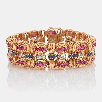 941. An 18K gold Bucherer bracelet set with blue and pink sapphires and round brilliant-cut diamonds.