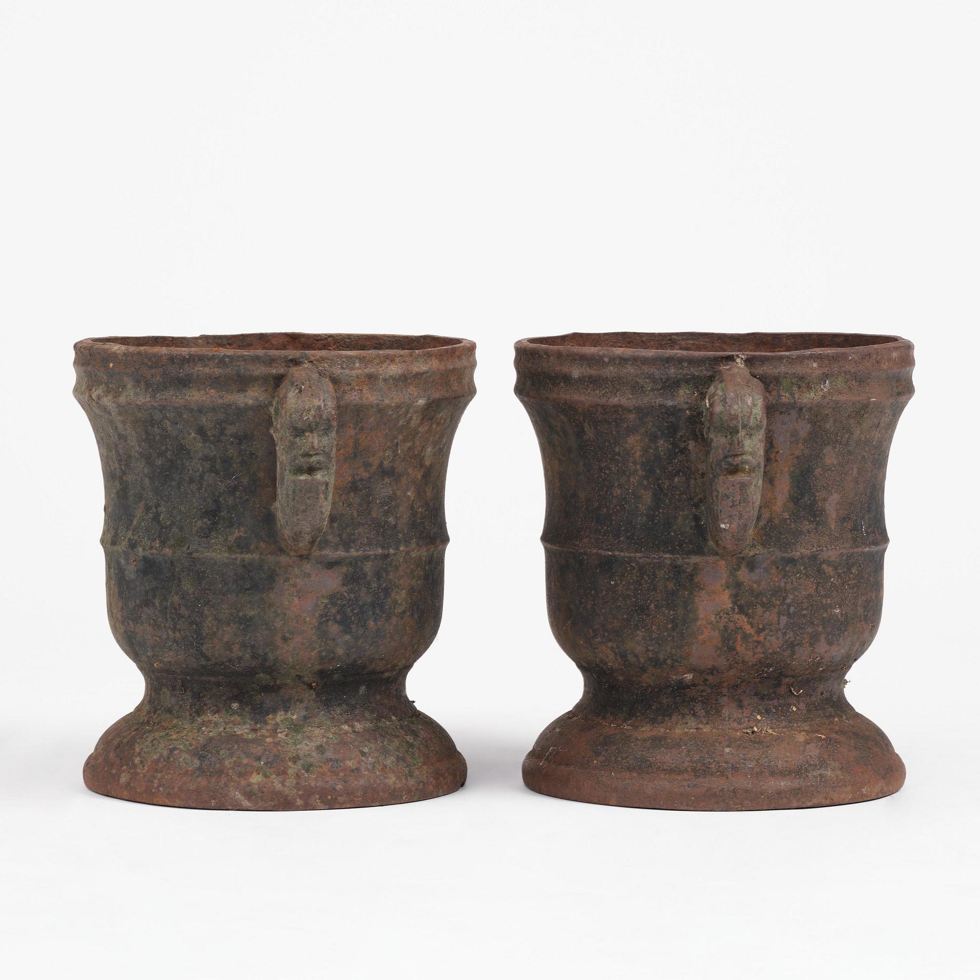 A pair of Swedish cast-iron garden urns, 18th century.