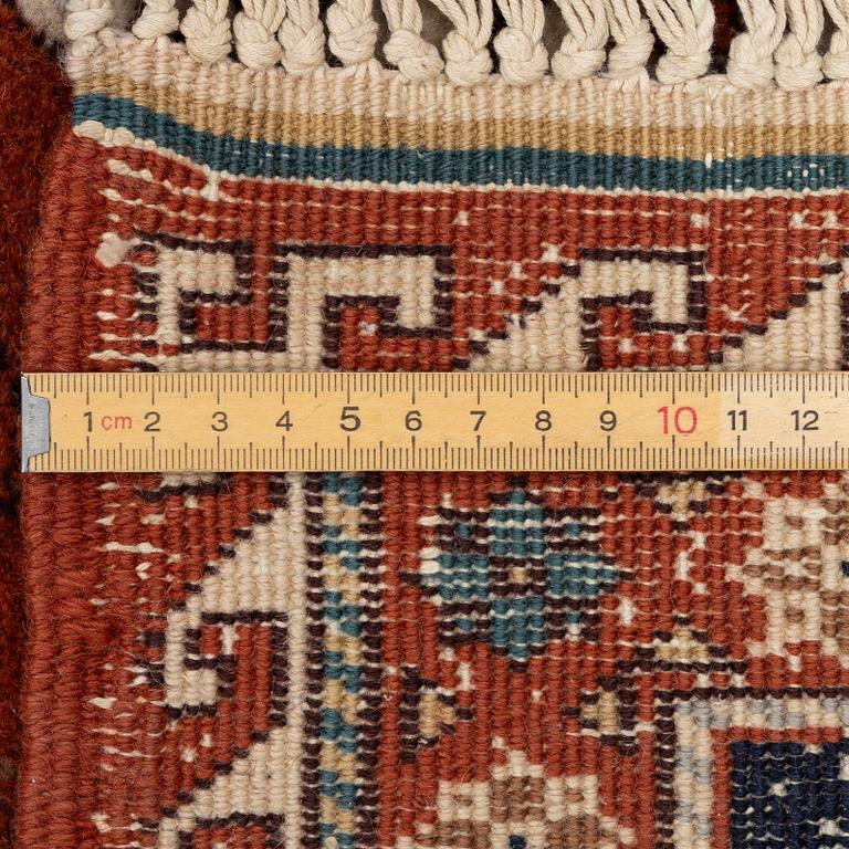 A semi-antique Orientall carpet c. 318 x 202 cm.