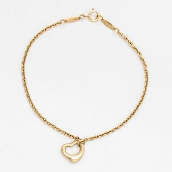 Tiffany & Co, an 18K gold 'Open Heart' bracelet.