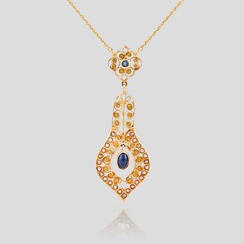 795. A necklace set with seed pearls, a cabochon cut sapphire, probably another sapphire and filigree work.