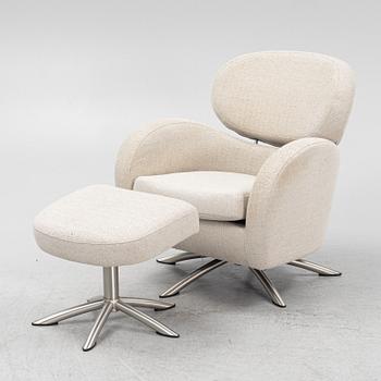 A 'Sting' swivel easy chair with stool, Brunstad, Norway.