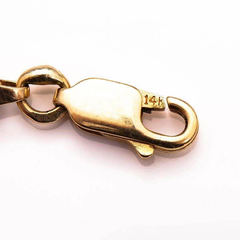A 14K gold bracelet.
