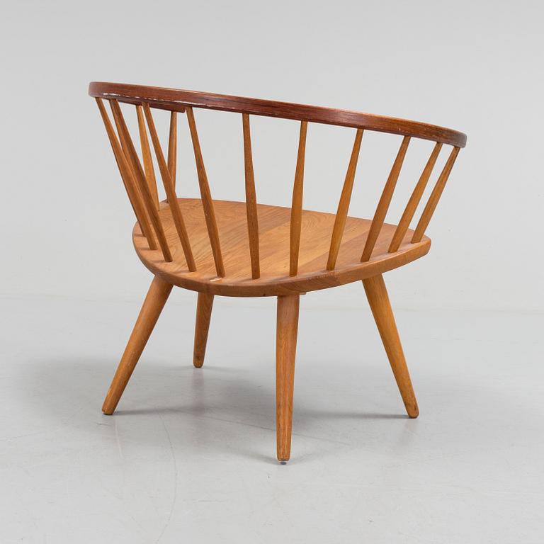 A teak 'Arka' armchair.
