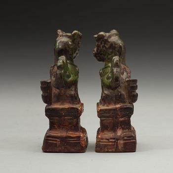 A pair of green and yellow glazed joss stick holders, Ming dynasty (1368-1644).