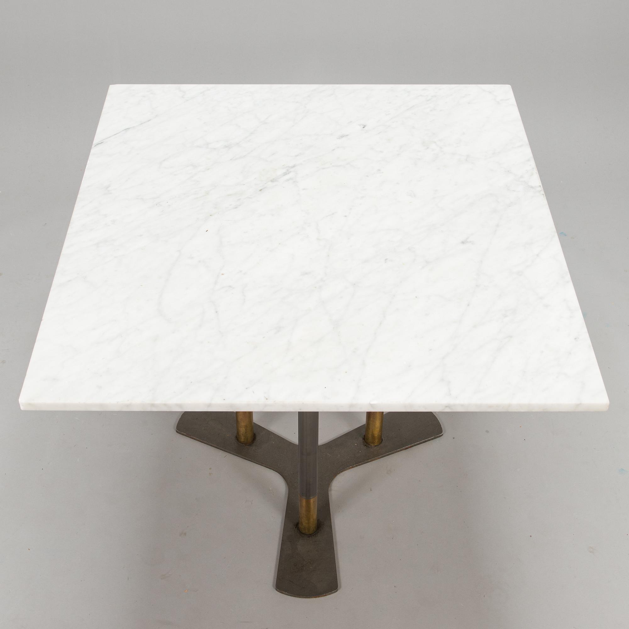 A marble top table, 21th century.