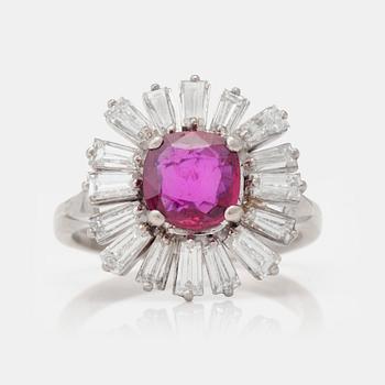 830. A circa 2.00ct ruby and trapezoid-cut diamond ring. Total carat weight of diamonds circa 1.50 cts.
