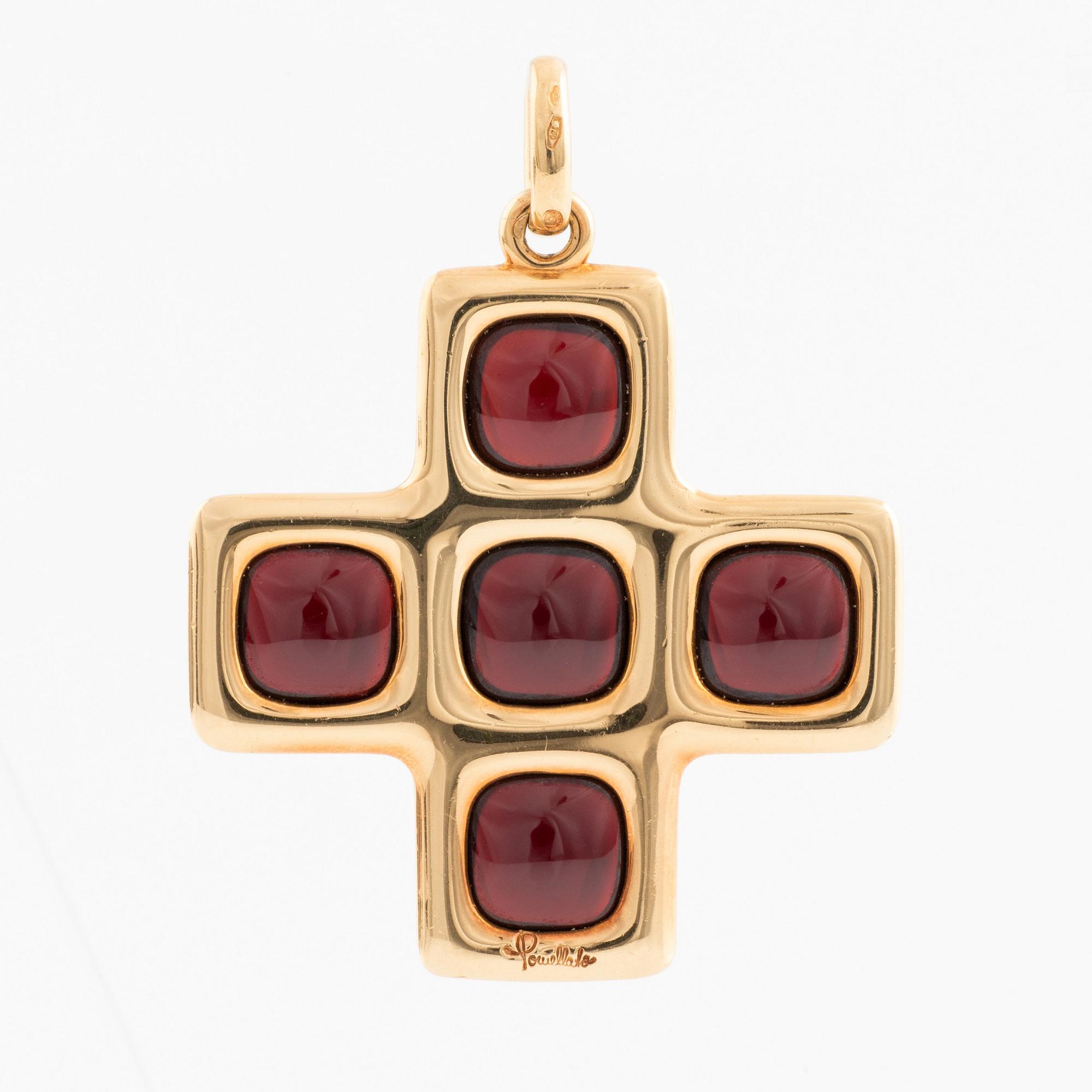 An 18K gold and garnet Pomellato cross.