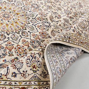 A Keshan rug, 340 x 236 cm.