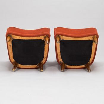 A pair of mid-20th-century armchairs.