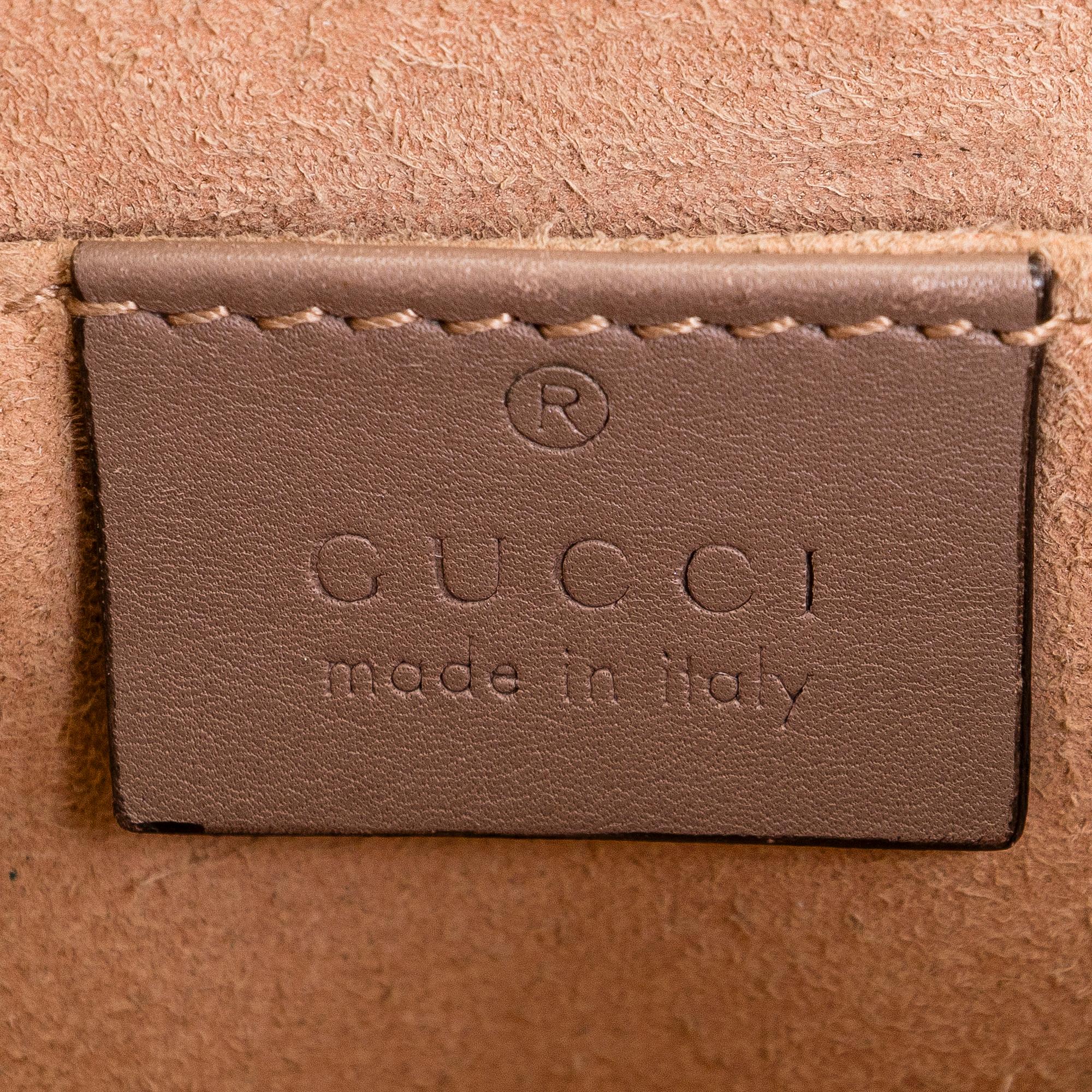 Gucci, a shoulder bag.