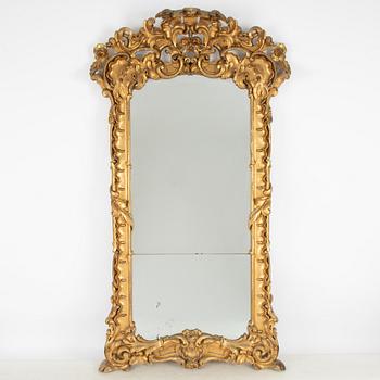 A large rococo-revival gilt-gesso mirror, later part 19th century.