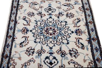 A runner carpet, Nain, part silk, 9 laa, signed, ca. 380 x 80 cm.