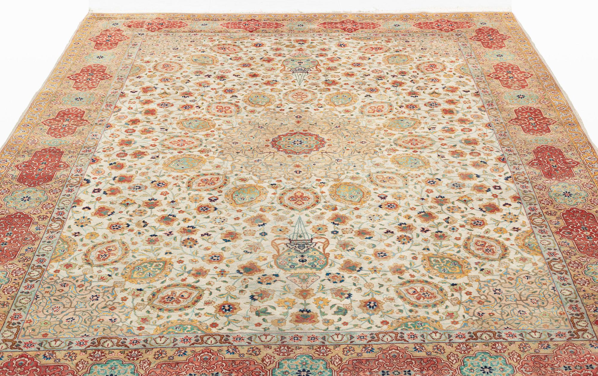 A carpet, semi-antique, Tabriz, ca 298 x  228 cm.