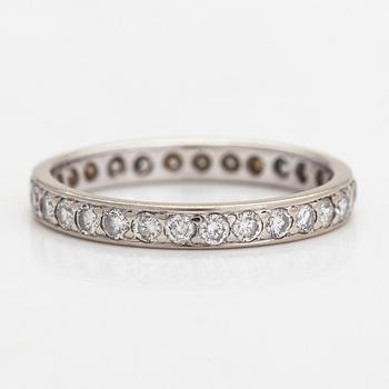 An 18K white gold eternity ring with brilliant-cut diamonds totalling approximately 0.60 ct.