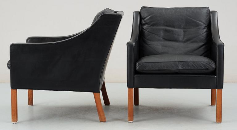 A pair of black leather Børge Mogensen armchairs, Fredericia, Denmark.