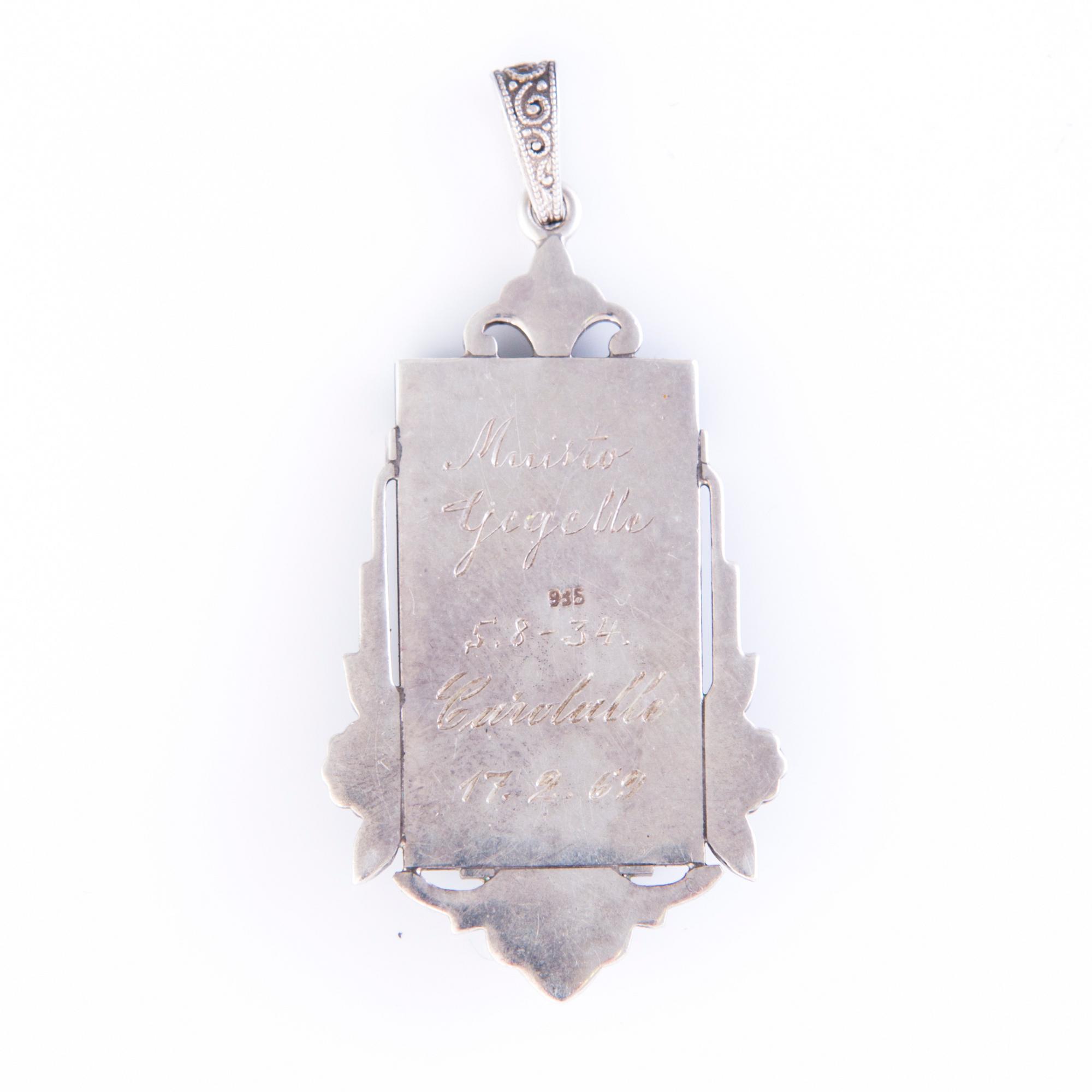 Four Art deco jewelry, ring, pendant necklace and earrings in silver.