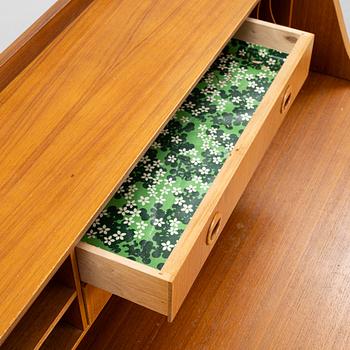 A teak-veneered desk, mid 20th century.