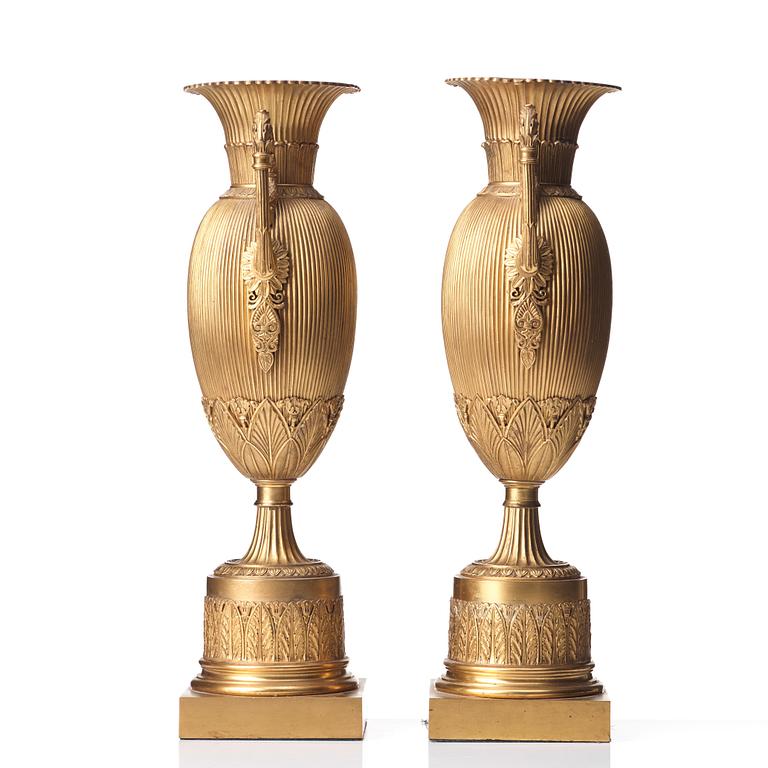 A pair of Empire-style urns, late 19th century.