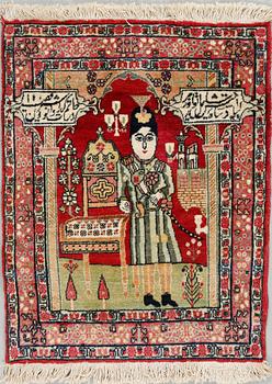 A Kirman rug, semi-antique, ca 78 x 60 cm.