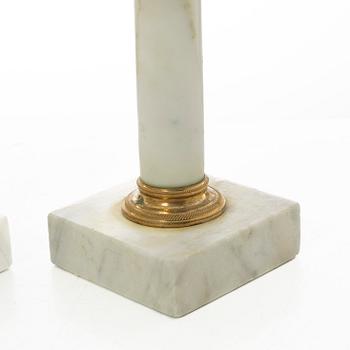 A pair of late Gustavian gilt brass and marble candlesticks, circa 1800.