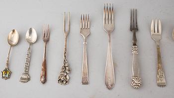 A collection of silver of 57 pcs, i.a souvenir spoons, 20th century. Total weight 1073 g.