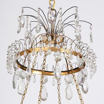 A late Gustavian five-light gilt brass and cut glass chandelier, Stockholm, late 18th century.