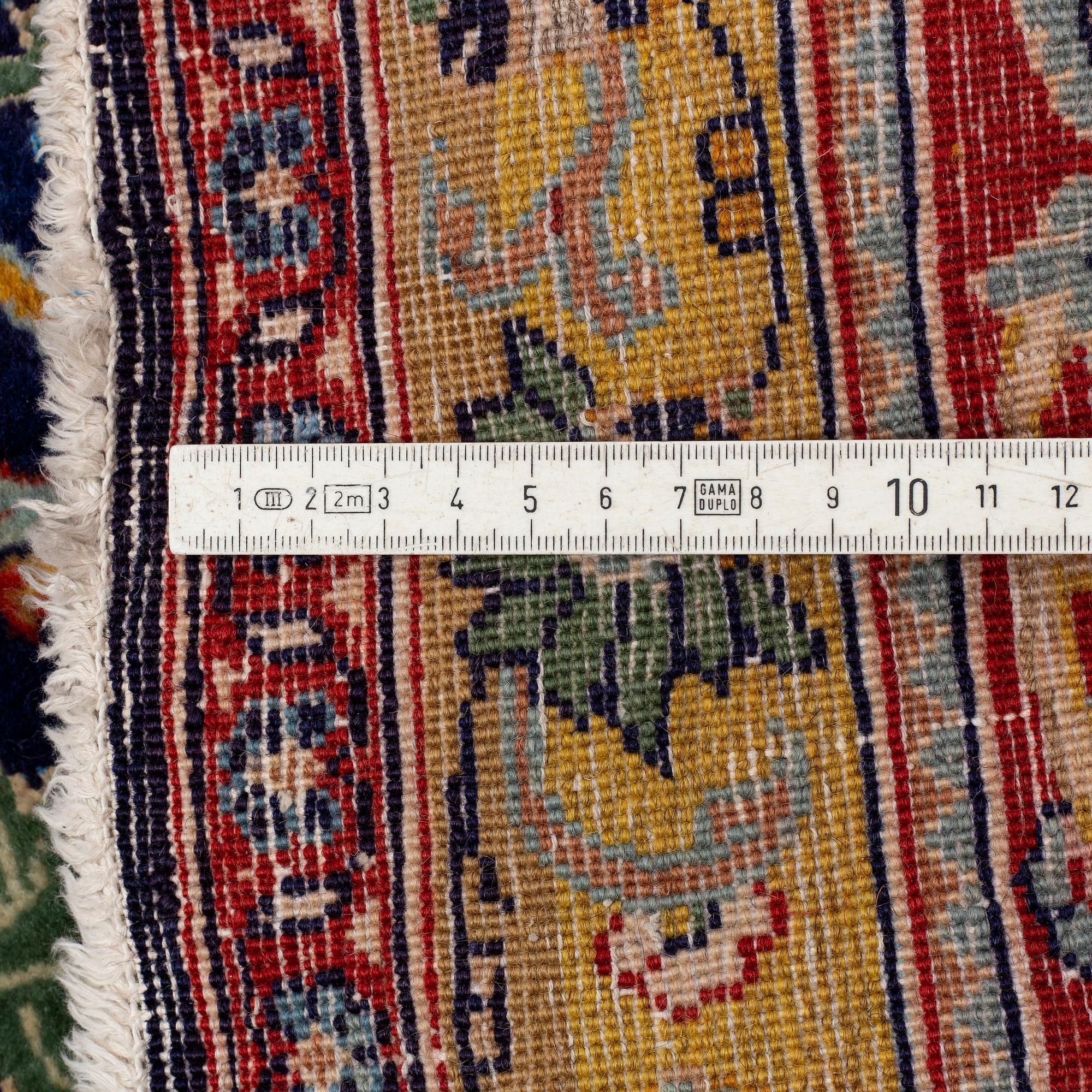 A CARPET so called Royal Kashan, part silk, signed, ca 483 x 311 cm.