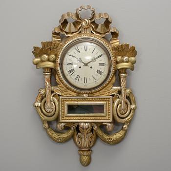 VÄGGPENDYL. Empire, 1800-talets första hälft.