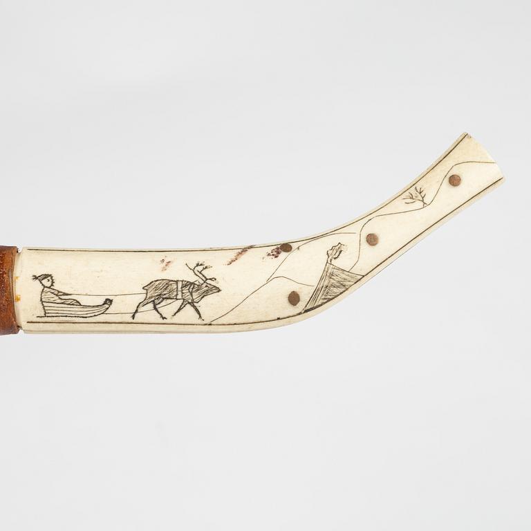 A reindeer horn knife, signed AL.