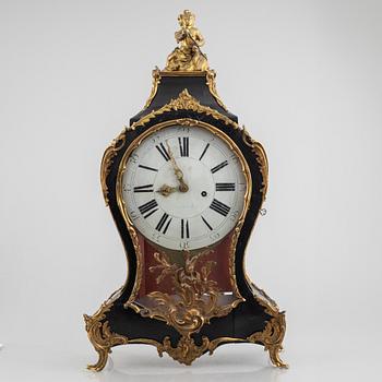 Clock, Rococo style with partially older parts, around the year 1900.
