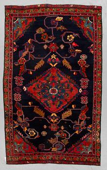 A rug, semi-antique Kurdish, ca 194 x 112 cm.