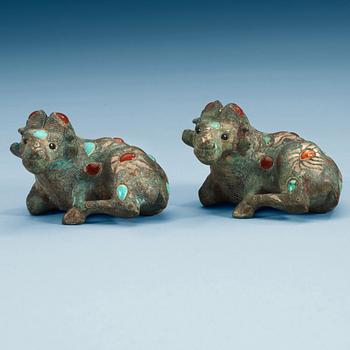 Two archaistic bronze weights with stone inlay, China.